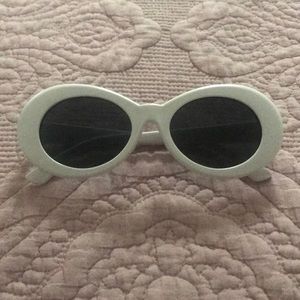 White oval sun glasses